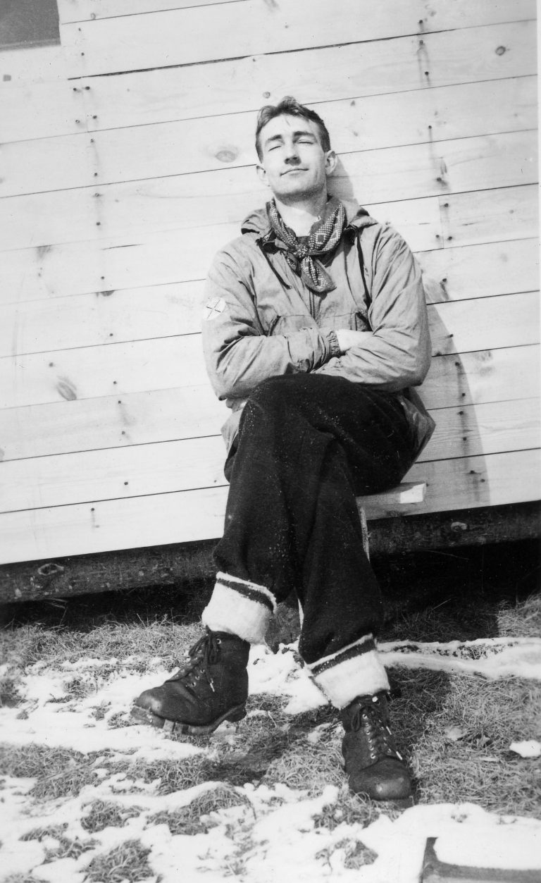 Dave Packard sitting outdoors with his eyes closed.