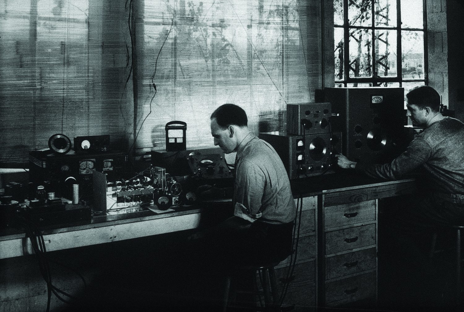 Photo of Vic Carson working at a workbench.