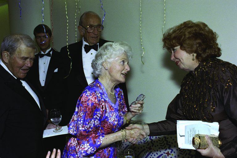 Rosemary Hewlett shaking hands with opera singer Beverly Sills.