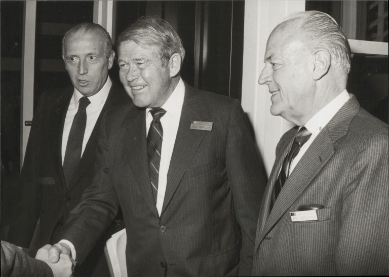 Bill Hewlett shakes the hand of someone out of frame during a celebration at Hewlett-Packard S.A. in Geneva.