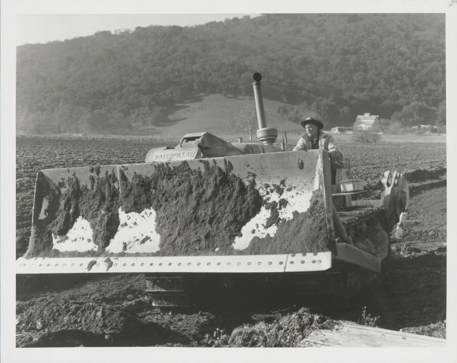 Dave Packard behind the wheel of a bulldozer clearing a road for the San Felipe Ranch.