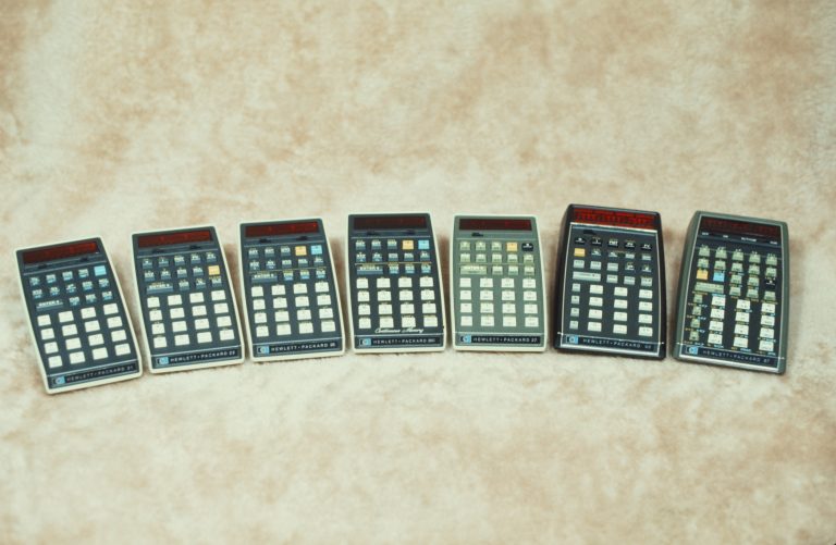 Photo of seven handheld calculators Hewlett-Packard offered within four years of introducing the HP 35.