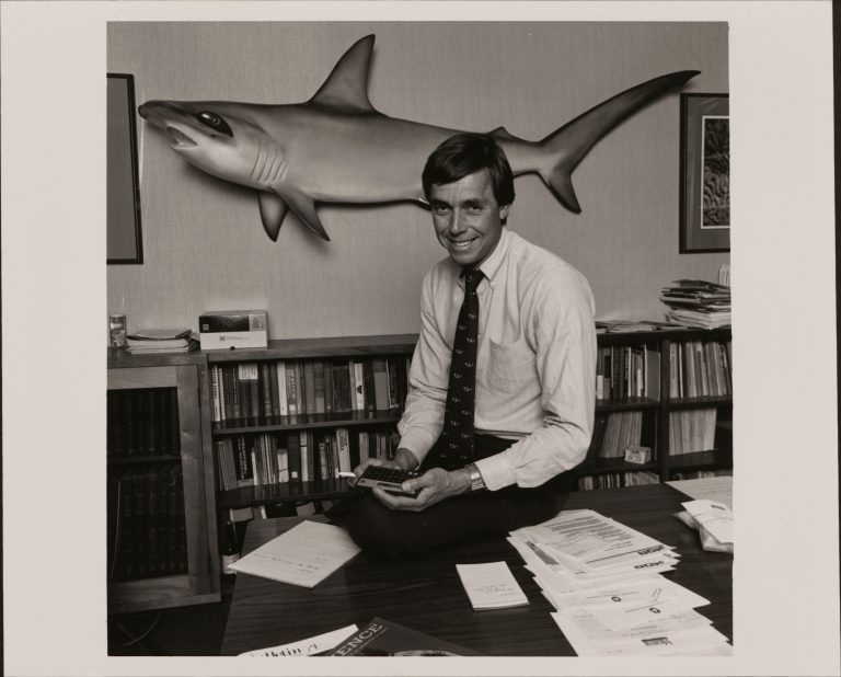 A marine biologist poses in his office with the HP 15C calculator.