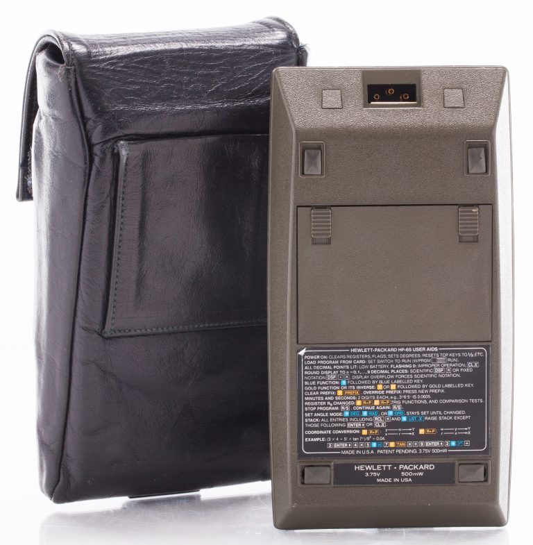 Photo of the back of the HP 65 programmable calculator and carrying case.