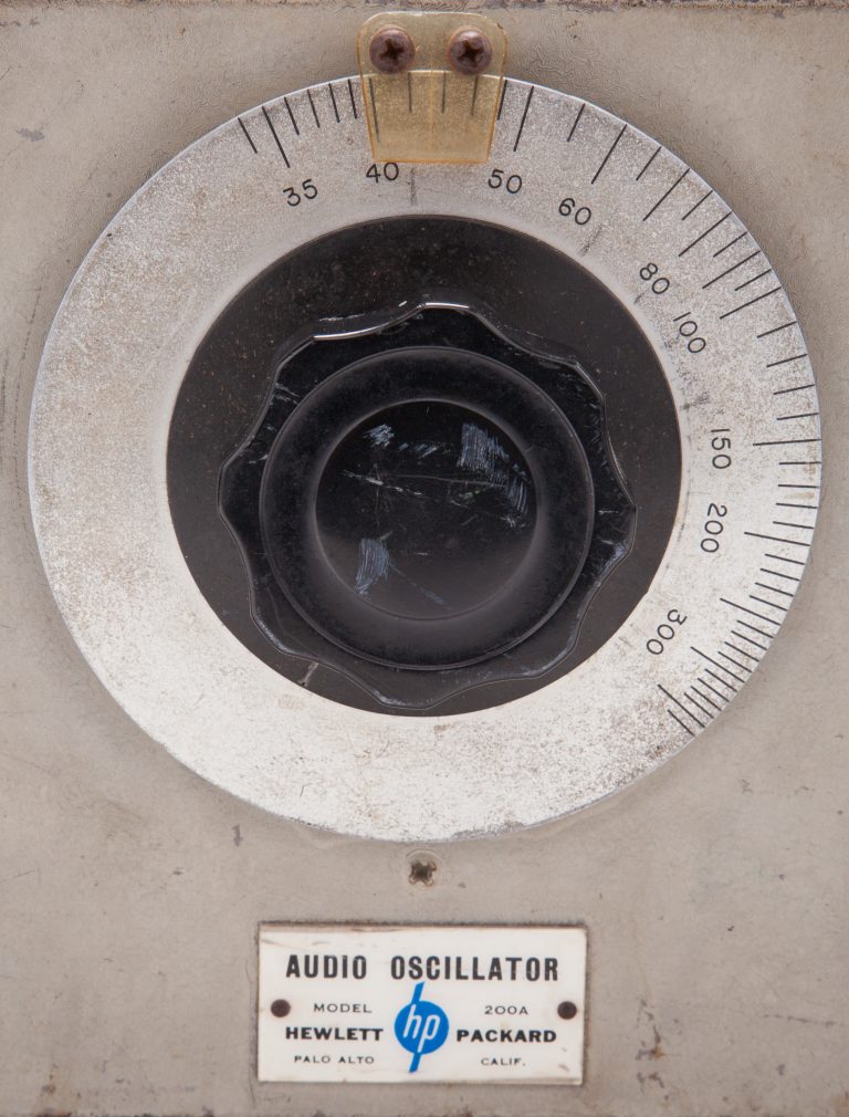 Close-up photo of a dial and the metal nameplate for the HP 200A oscillator.