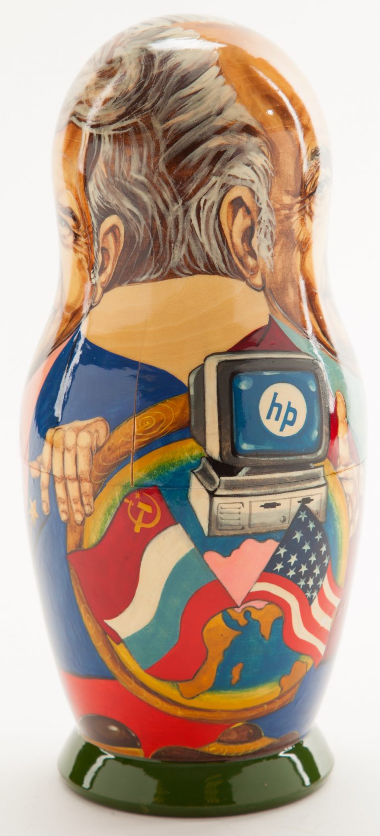 Side of the Bill/Dave matryoshka doll featuring an HP computer and the Russian and US flags.