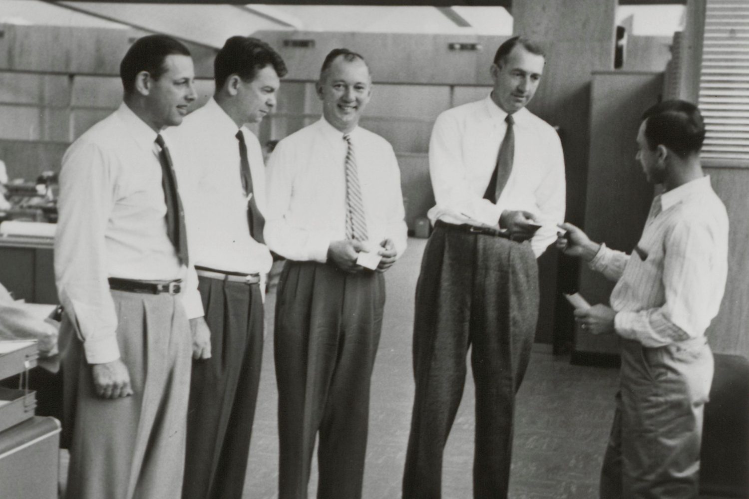 Bill and Dave chatting with Noel Porter and others in 1955.