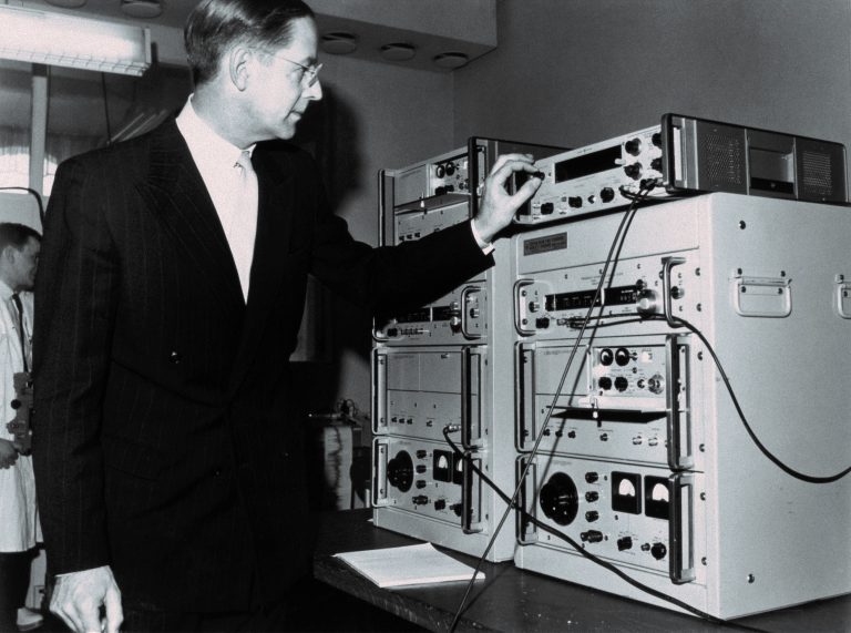 A man works on Hewlett-Packard's 5060A atomic clock in 1964.