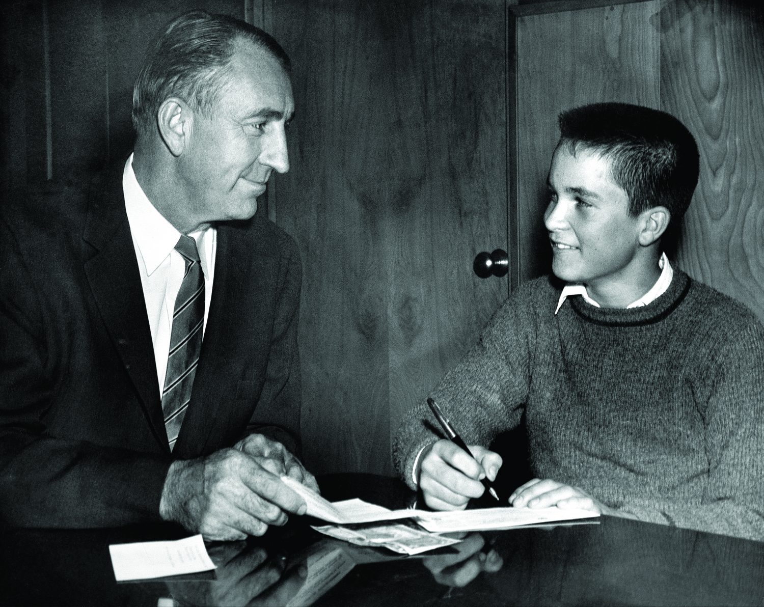 Dave Packard working with a student as part of the Junior Achievement program in 1959.