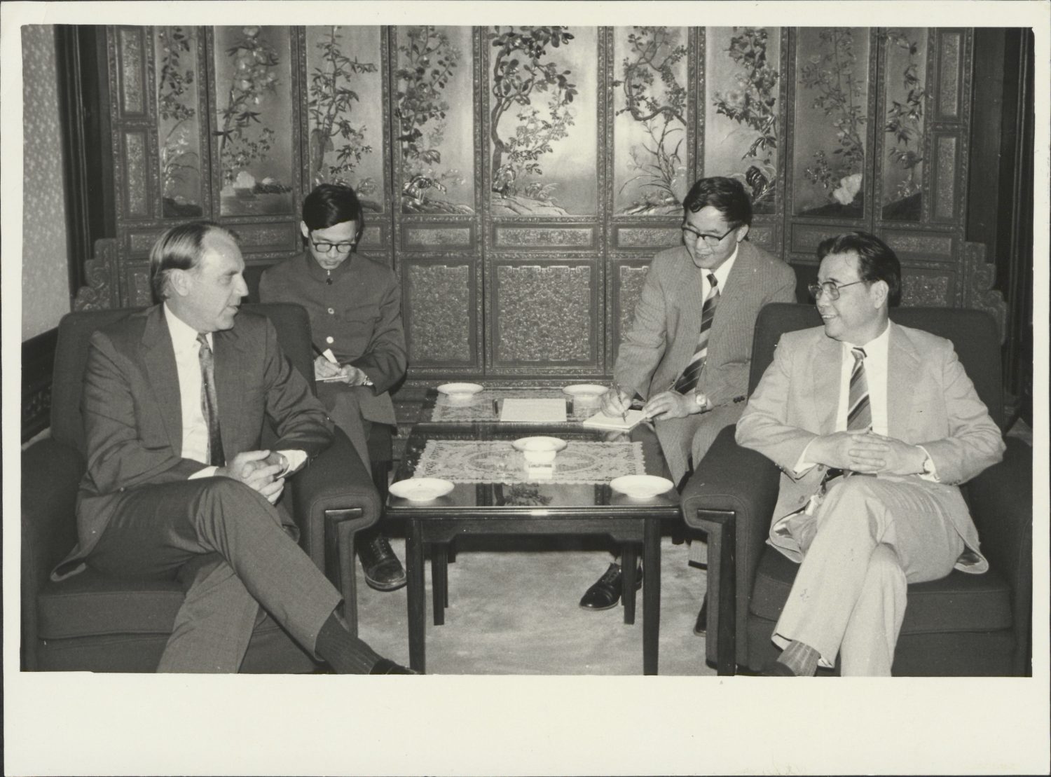 Hewlett-Packard CEO John Young speaks with Chinese officials during a visit to China in 1984.