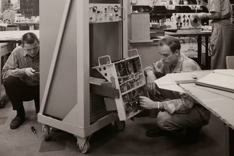 Technicians from the Dynac Division working on the DY-2500 Computing Digital Indicator.