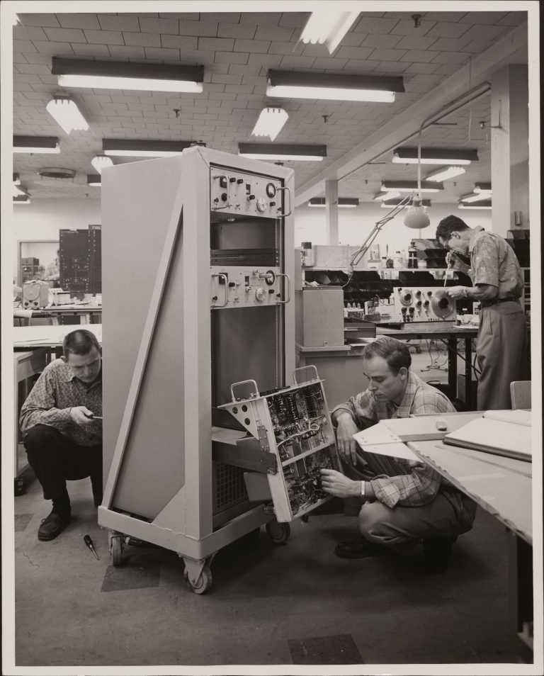 Technicians from the Dynac Division working on the DY-2500 Computing Digital Indicator.