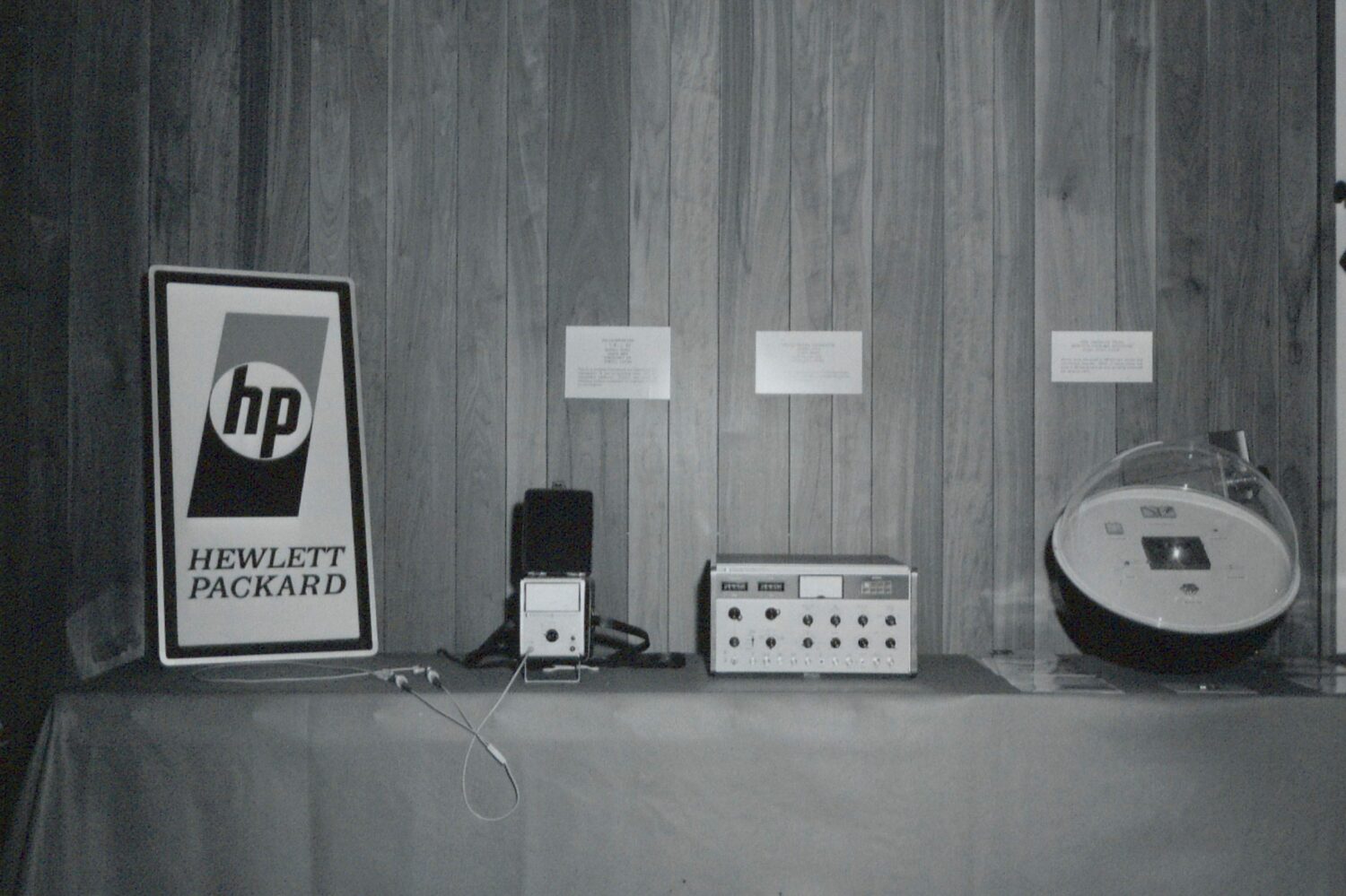HP's 1967 logo. The letters h & p sit inside a circle with shading above/below and Hewlett and Packard spelled out at bottom.