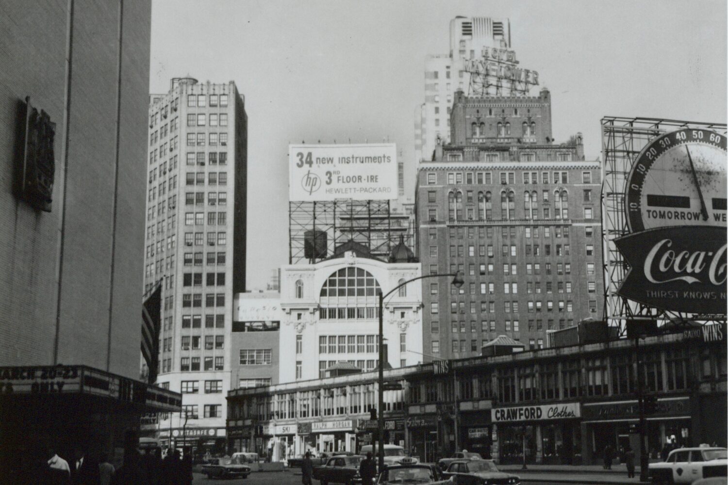 Photo of a billboard indicating 34 new instruments featured by HP on 3rd floor of the IRE in 1957.