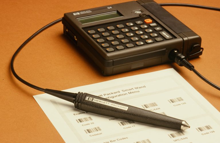 Photo of the HP 94 Handheld Computer with attached barcode wand.