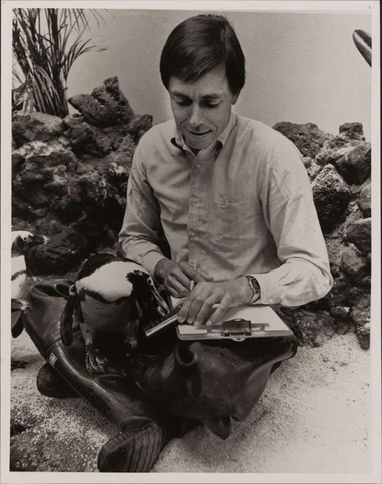 A marine biologist poses in his office with the HP 15C calculator.