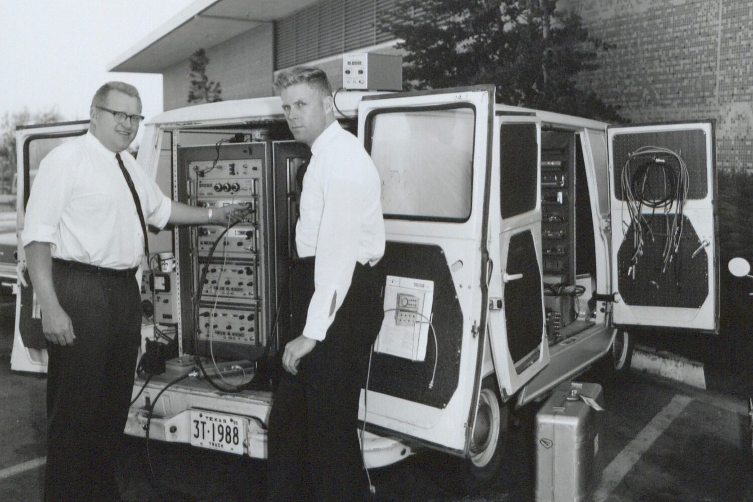 A white van that has been outfitted with HP equipment to serve as a Travelab in the 1960s.