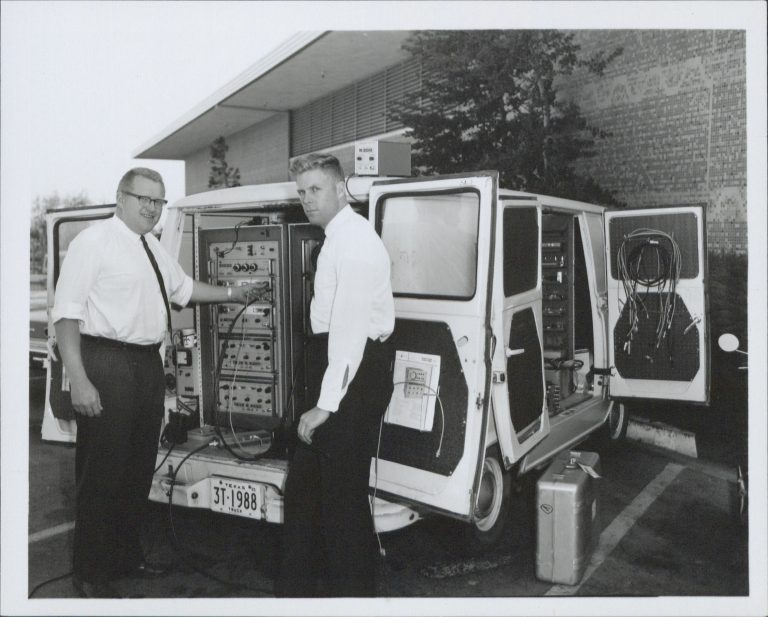 A white van that has been outfitted with HP equipment to serve as a Travelab in the 1960s.