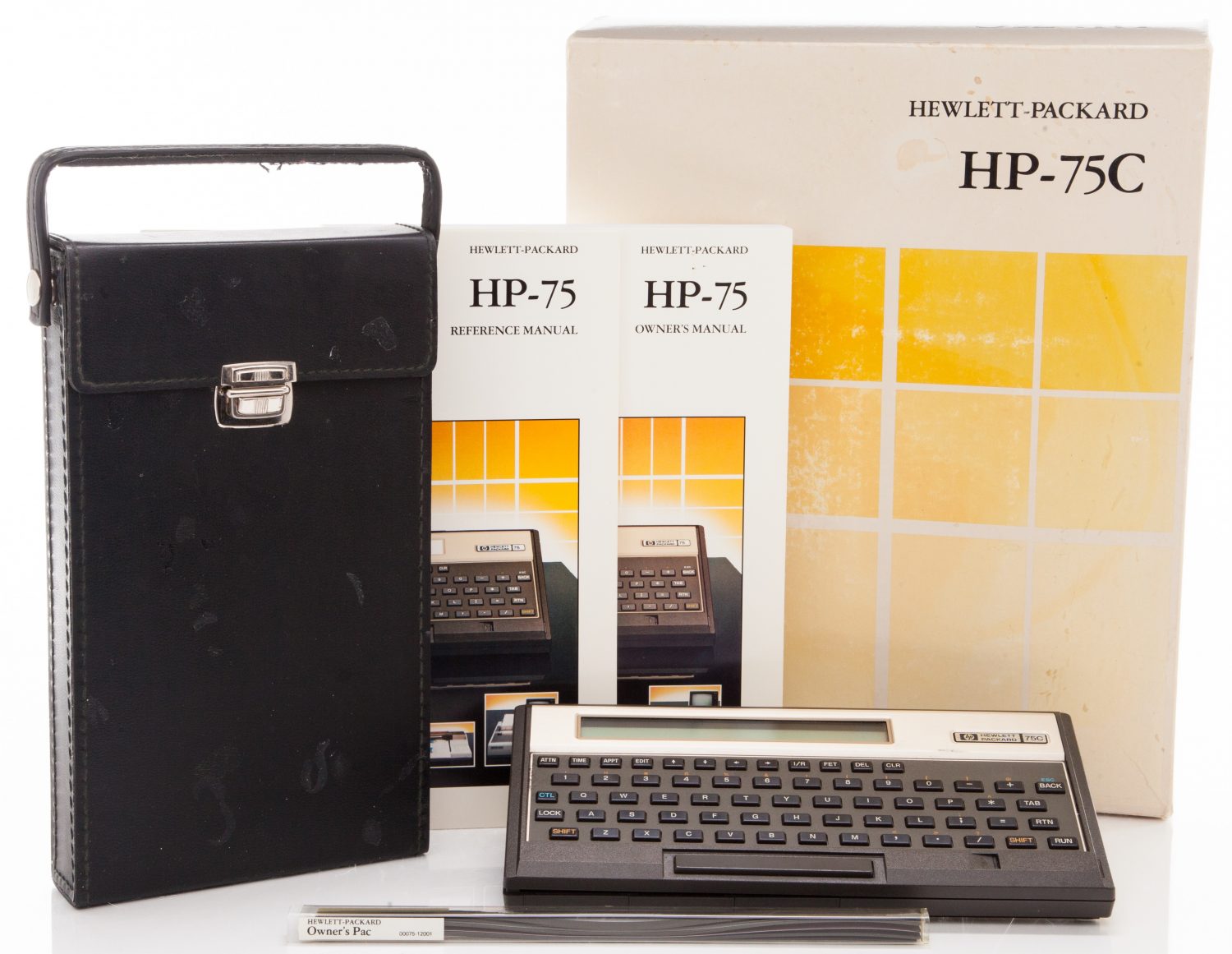 Photo of the HP 75C including carrying case, reference manual and owner's manual.