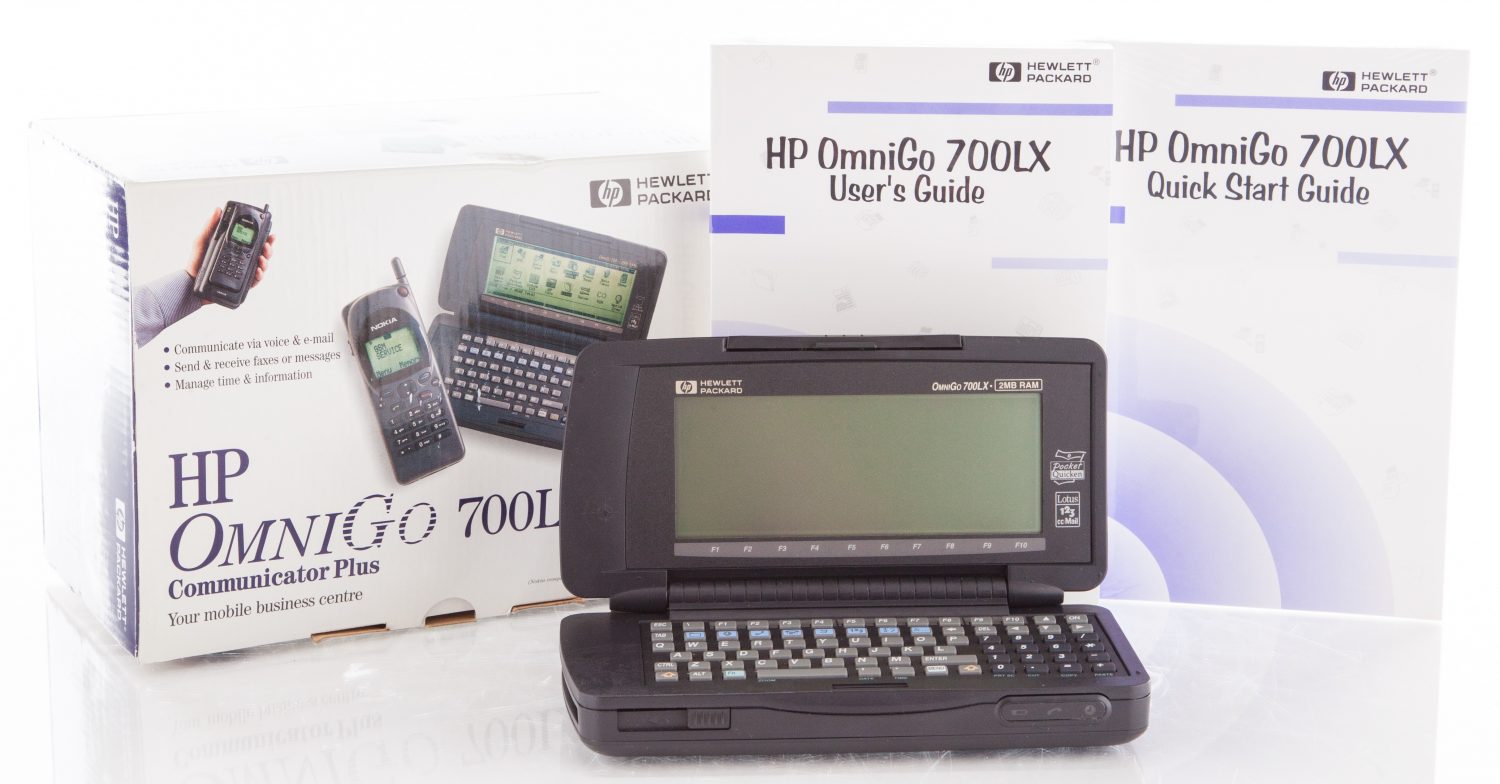 Photo of the OmniGo 700LX including box, User's Guide and Quick Start Guide.
