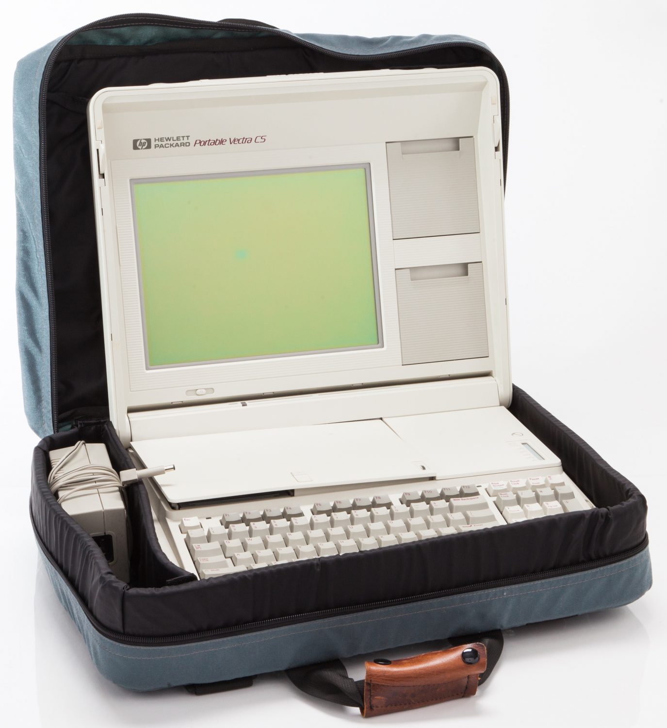 The Hewlett-Packard Vectra portable computer in carrying case with power adapter.