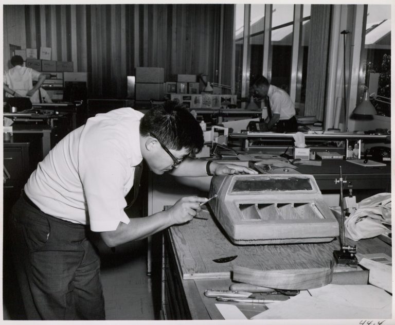 Designer Roy Ozaki crafting a visual prototype of the HP 9100A desktop calculator out of clay.