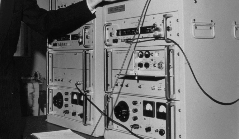 A man works on Hewlett-Packard's 5060A atomic clock in 1964.