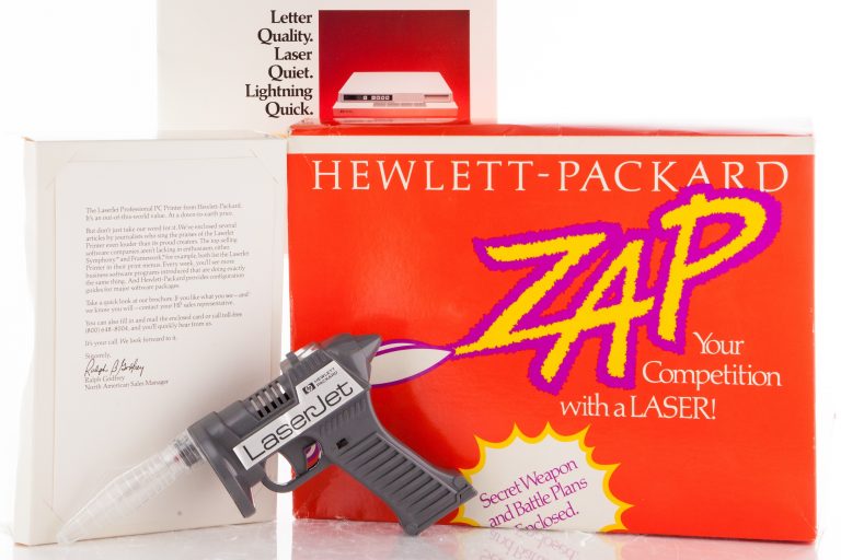 Toy laser gun and associated materials promoting HP's LaserJet technology.