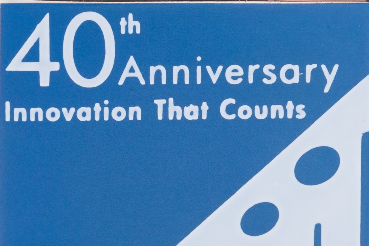 A pin celebrating the 40th anniversary of HP Labs. Reads 40th Anniversary Innovation That Counts HP Labs 1966-2006.