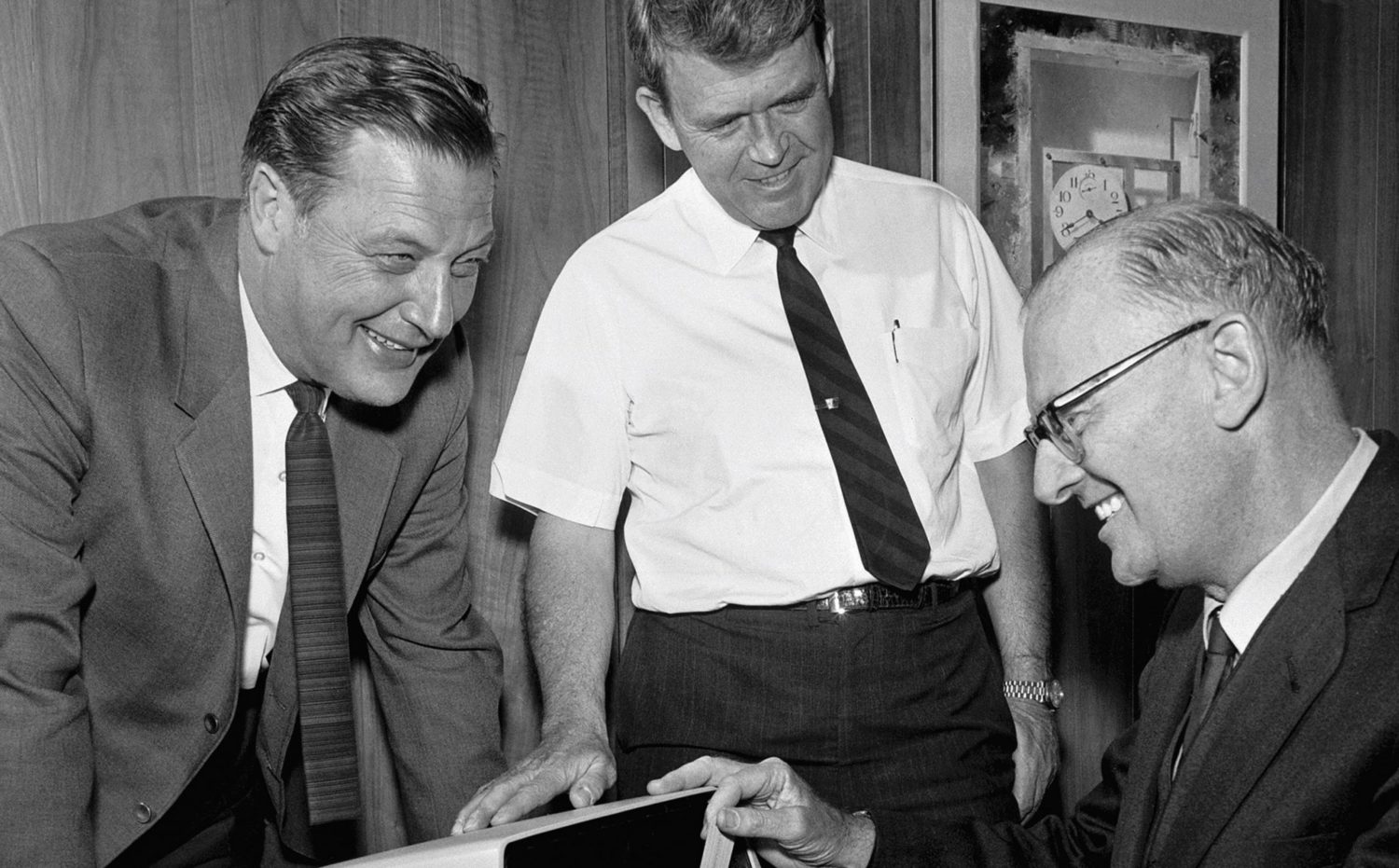 Barney Oliver and Bill Hewlett showing science fiction author Arthur C. Clarke a prototype of the HP 9100A. 