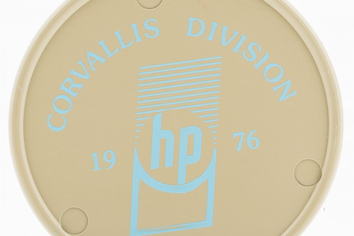 A coaster celebrating the opening of Hewlett-Packard's Corvallis facility in 1976.
