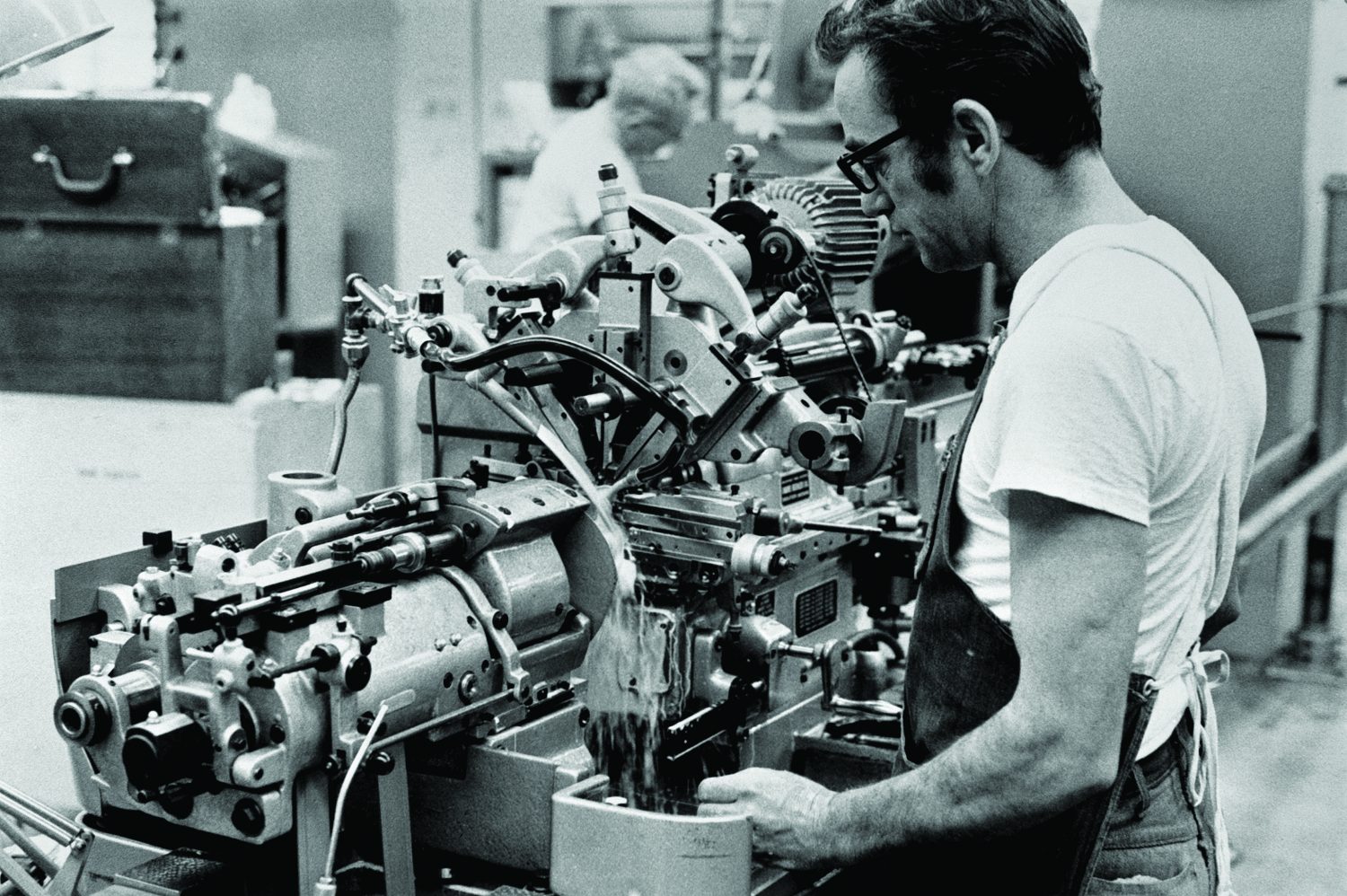 A man working at the Swiss screw machine in 1972.