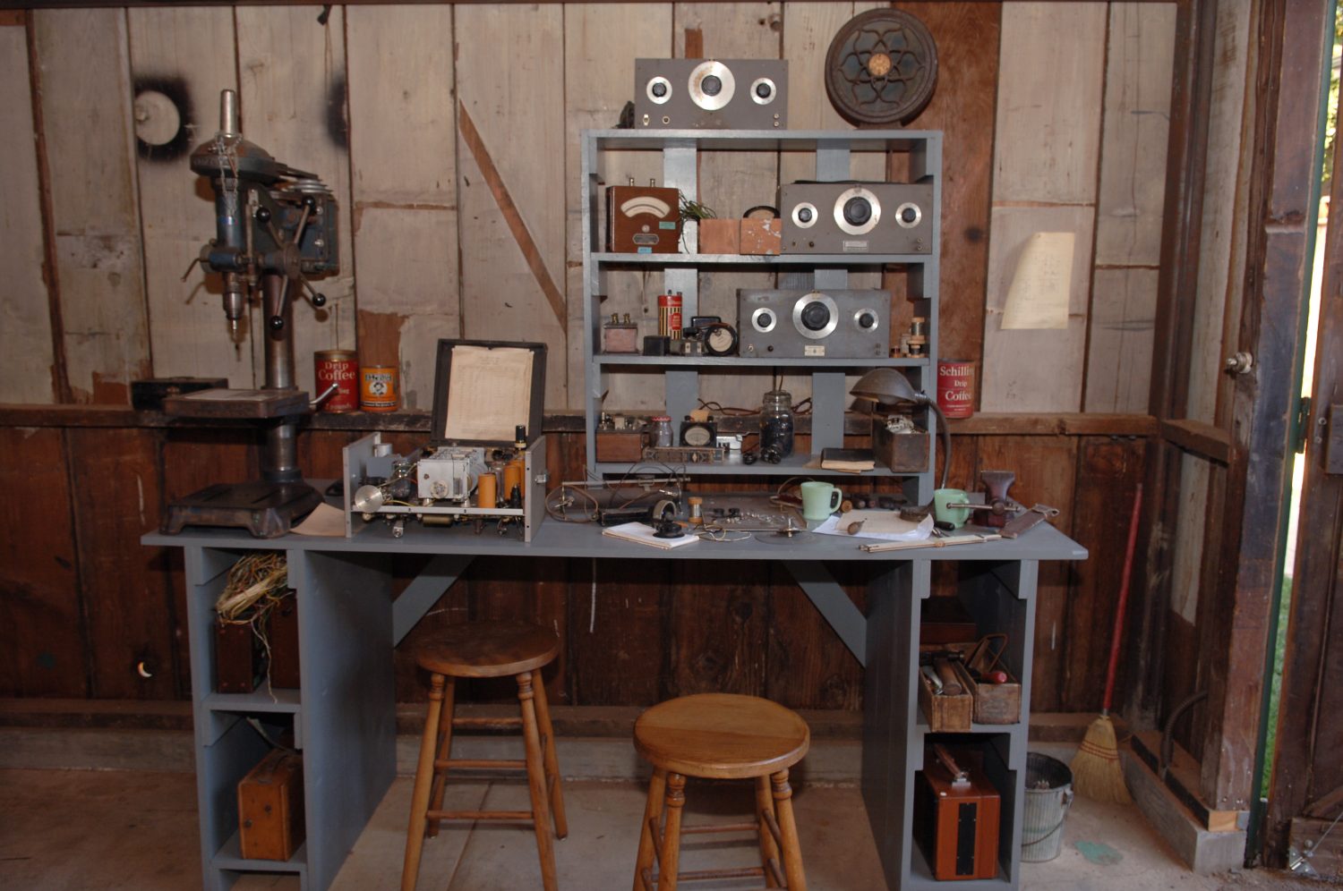 Close up of the restored garage workbench with 200A and 200B oscillators and drill press.