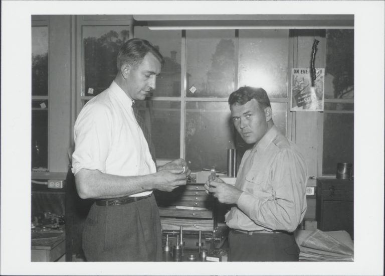 Photo of Dave Packard and Bill Hewlett working at a workbench in the 1940s.