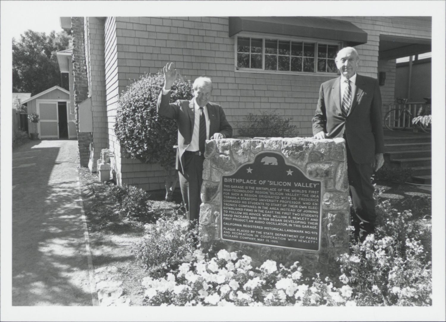 Bill Hewlett and Dave Packard standing beside the historic marker in front of 367 Addison Avenue.