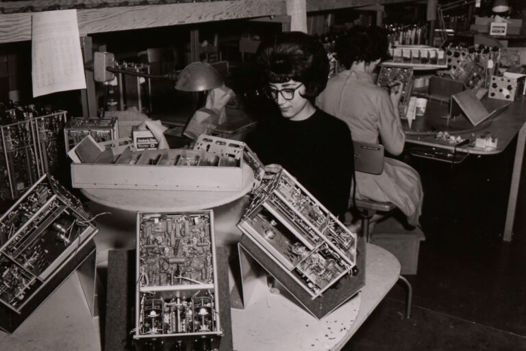 A woman working on the assembly line at Hewlett-Packard in the 1960s.