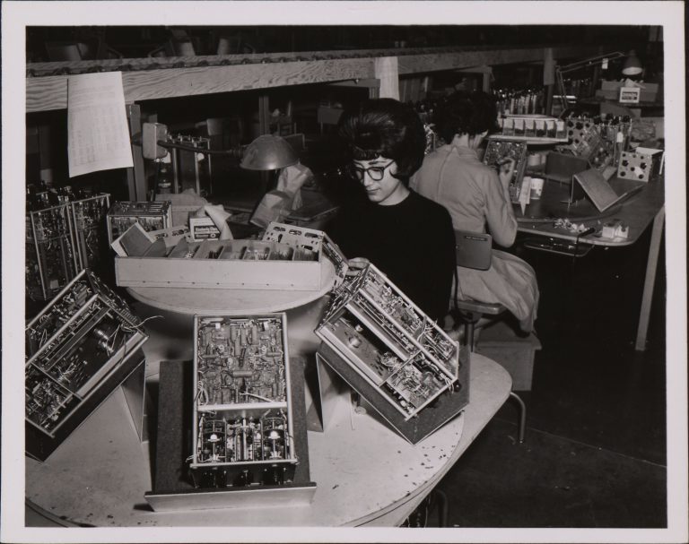 A woman working on the assembly line at Hewlett-Packard in the 1960s.