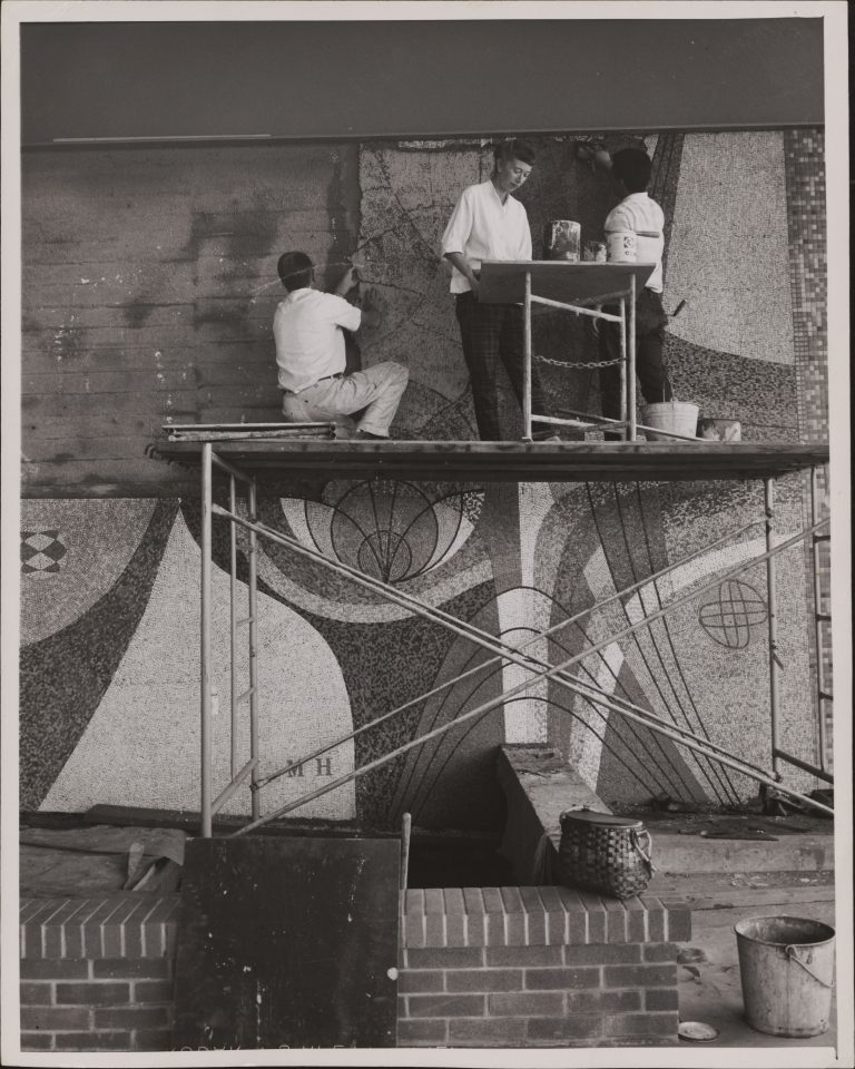 Mary Henry and two others installing a mosaic at the front entrance of 1501 Page Mill Road in 1960.