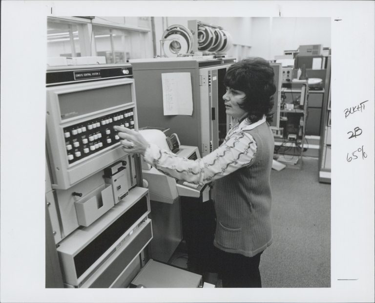 A woman working on the Comsys system used to communicate with HP facilities all over the globe in 1974.