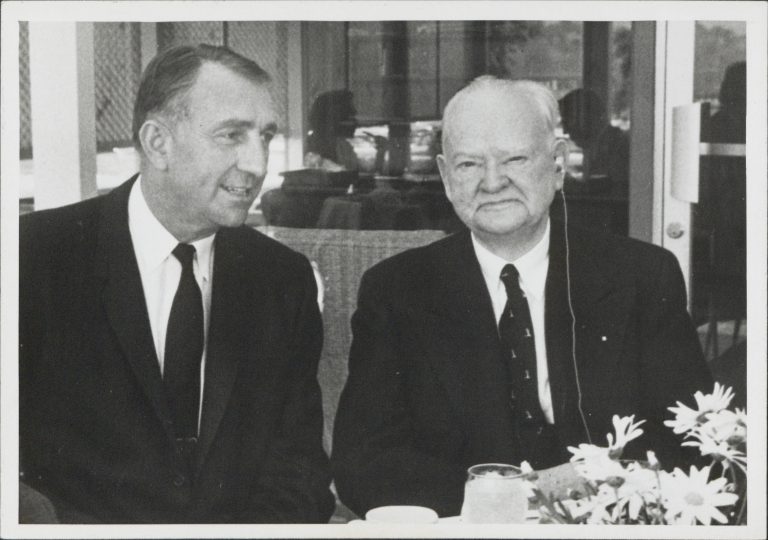 Dave Packard seated next to former US President Herbert Hoover in 1960.