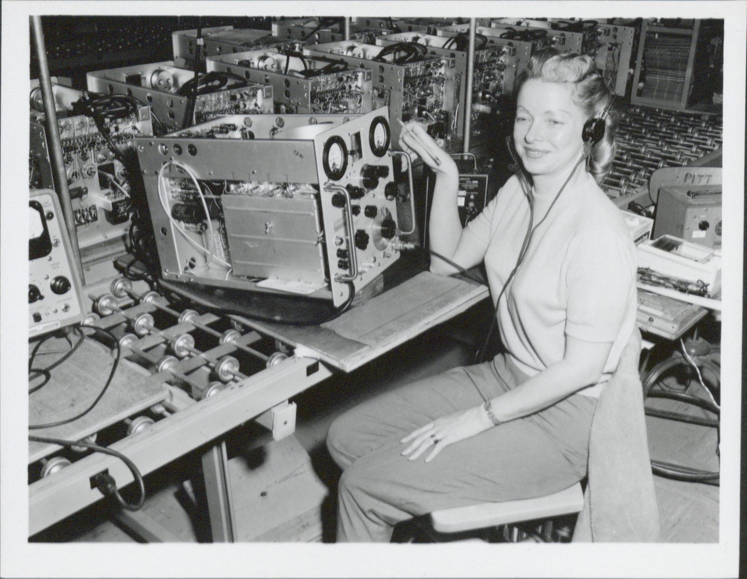 A photo of Ercil Joseph calibrating Hewlett-Packard's 608 signal generator.