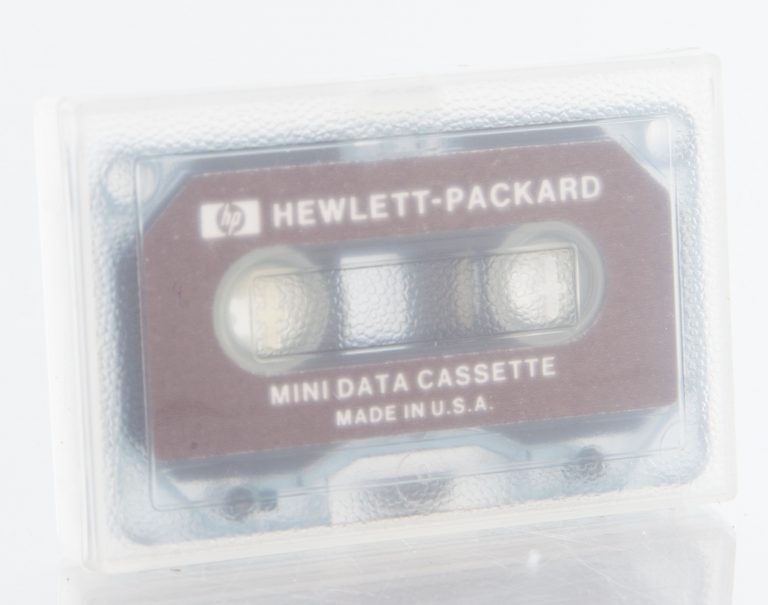 Front of an HP Mini Data Cassette in protective case.