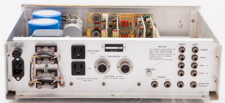The back of Hewlett's Barney Oliver Amplifier with numbers outputs and plugs.