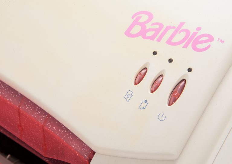 Close-up of the Barbie branding on the HP Apollo P1220.