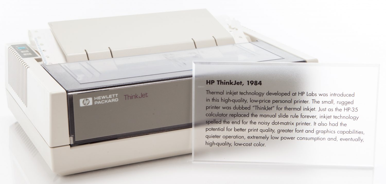 Photo of the HP 2225 ThinkJet printer with a clear plastic plaque describing the device.