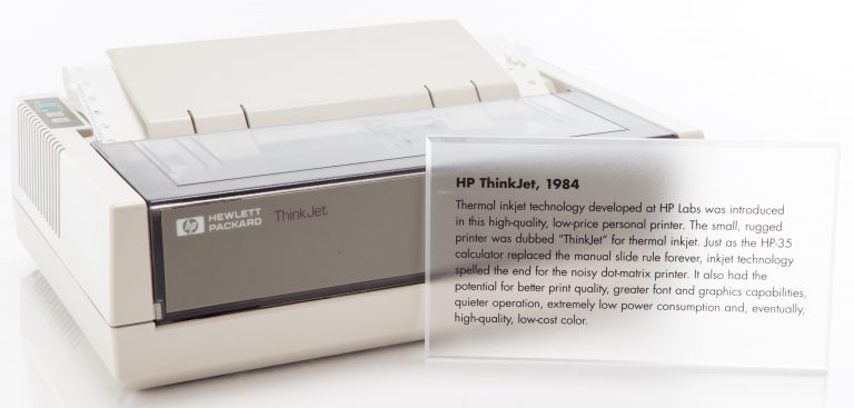 Photo of the HP 2225 ThinkJet printer with a clear plastic plaque describing the device.