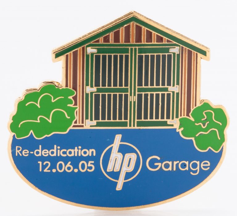 Commemorative pin depicting the Addison Avenue garage and reading 