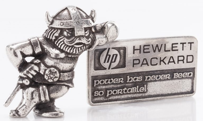 A small metal statue featuring a Viking leaning against the HP logo with the tagline power has never been so portable!