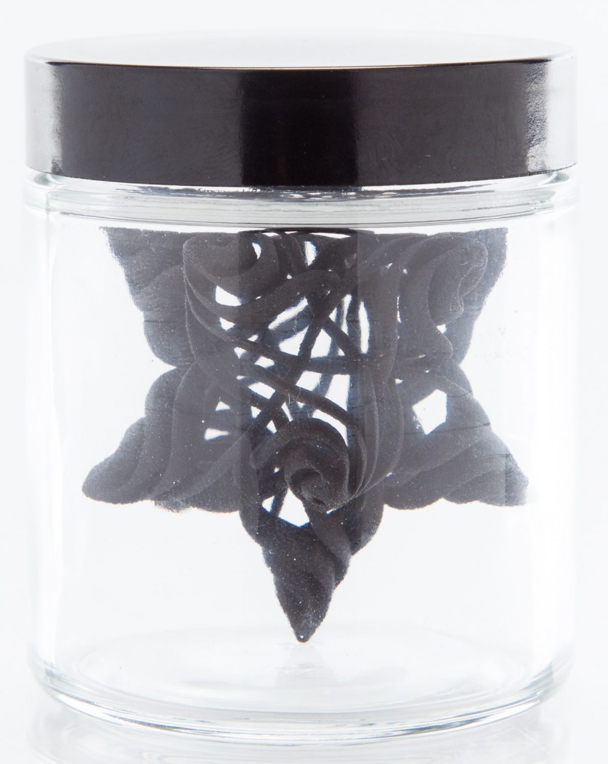 3D-printed geometric design in a glass container (side view).