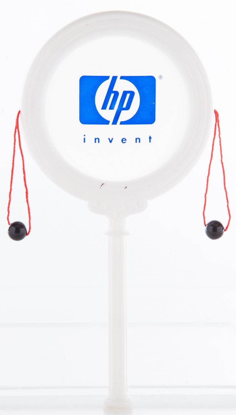 Hand drum with HP Invent logo.